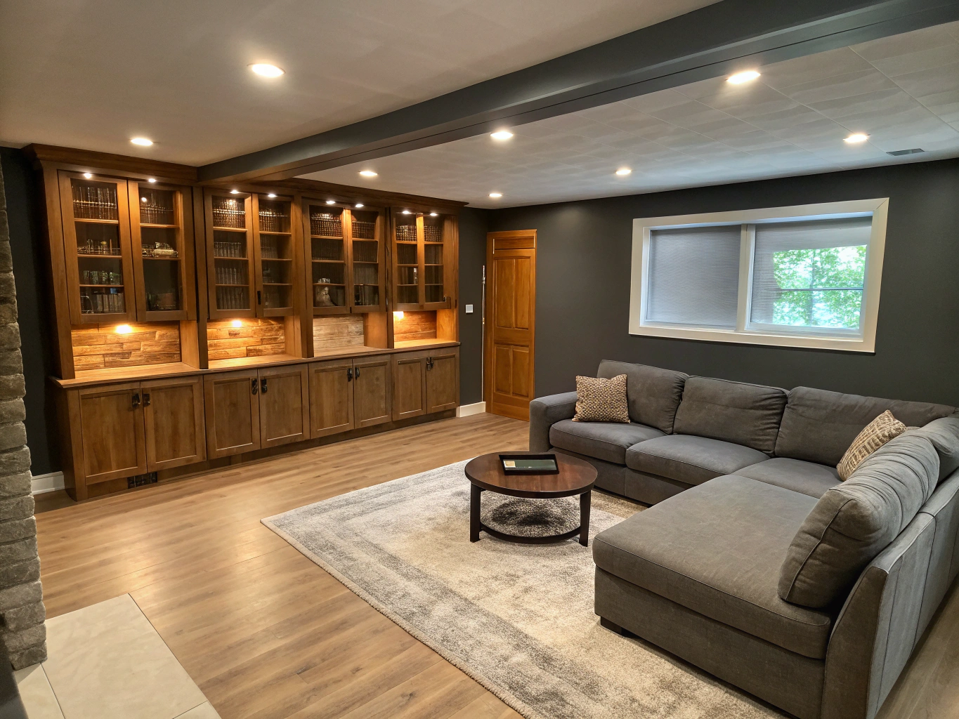 Finished subterranean living room with architectural lightwell